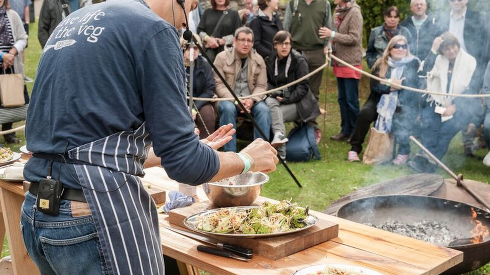 A chef showing a crowd of people how to cook at Abergavanny Food Festival 2017.