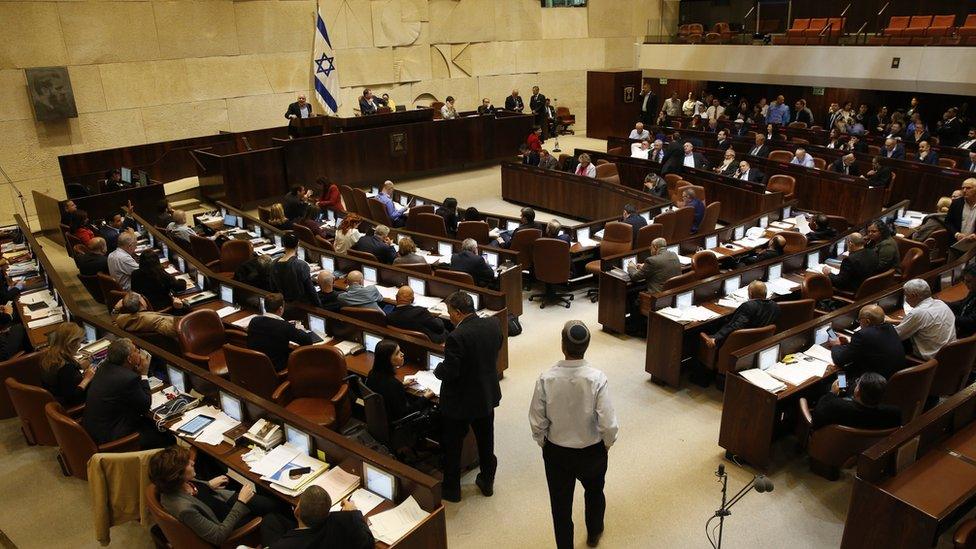 Israeli lawmakers vote on the controversial Police Recommendations Bill in the Knesset on 27 December 2017