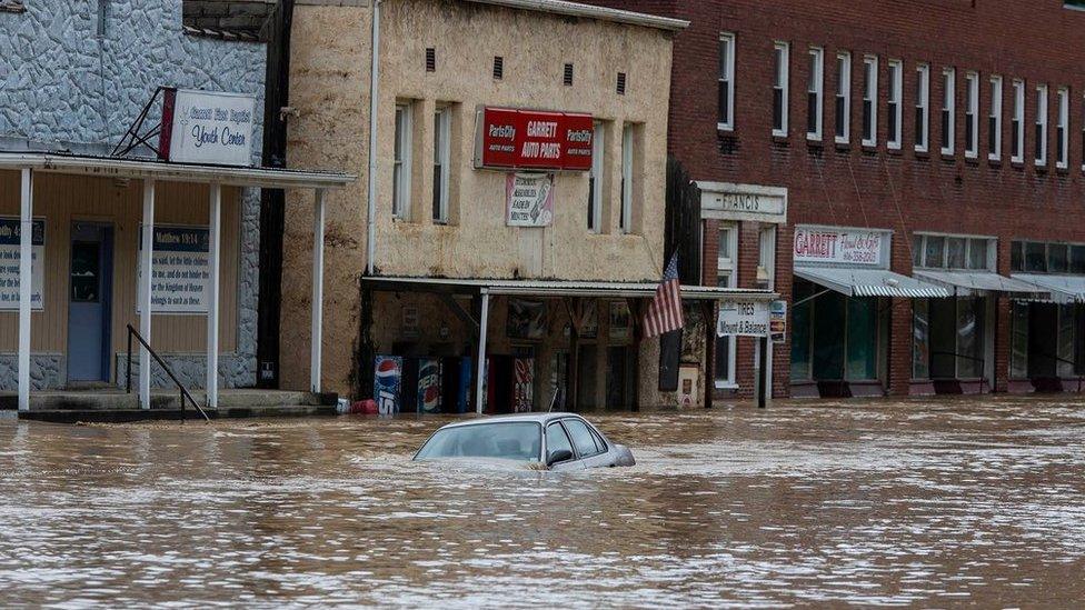 A car is submerged in flood waters on 28 July 2022.