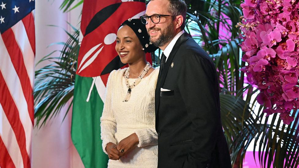 US Representative Ilhan Omar (L) and Tim Mynett arrive at the Booksellers Room of the White House on the occasion of the State Dinner with the Kenyan president at the White House in Washington