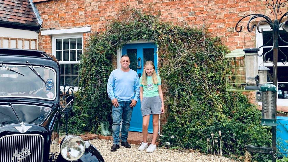 Alice with Grant Harvey outside this house in Riseley, Bedfordshire