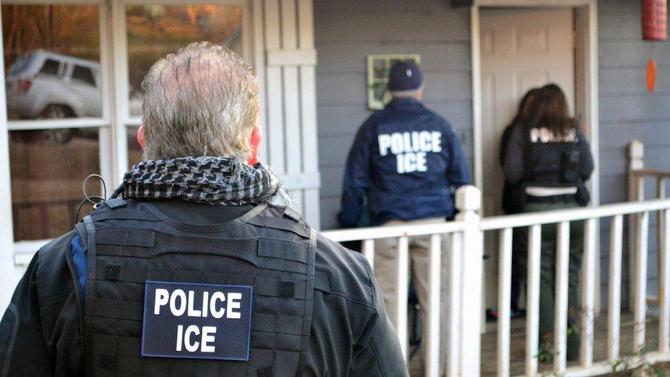 ICE officers at a raid