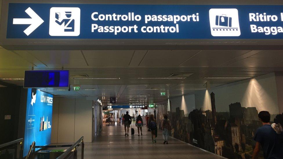 Passport control signs at Rome Fumicino airport