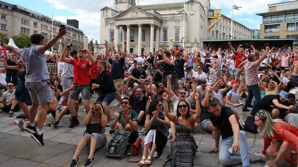 Fans celebrate England's quarter final win in Leeds