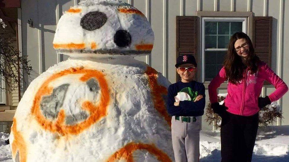 Kids pose with snowbot