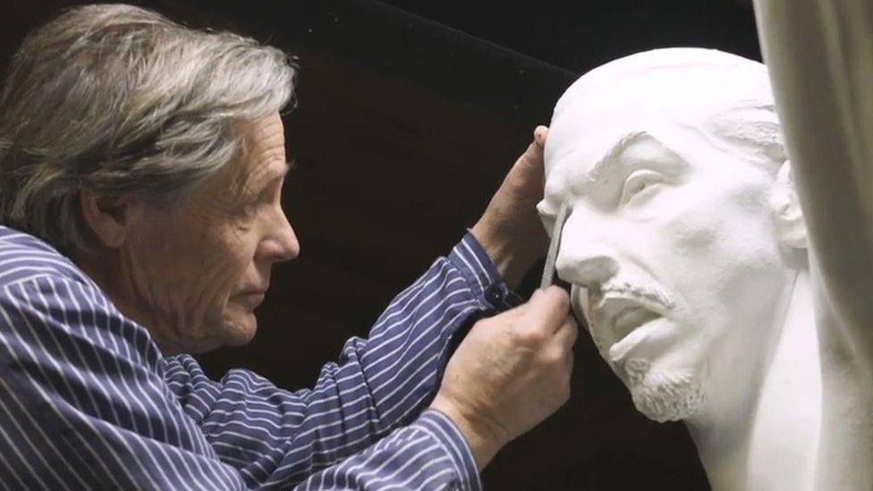 Sculptor Peter Linde works on the Zlatan statue