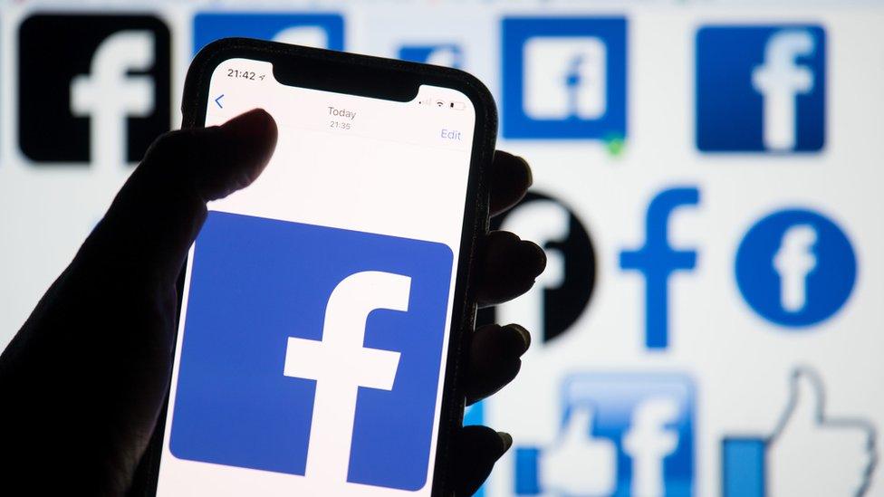 Facebook logo on smartphone screen