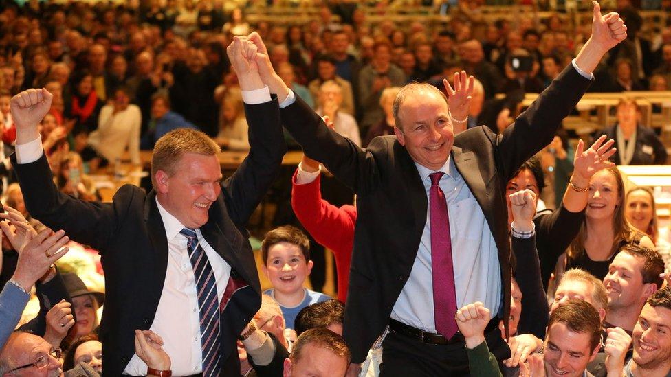 Fianna Fáil leader Micheal Martin and party colleague Michael McGrath celebrate at an election count