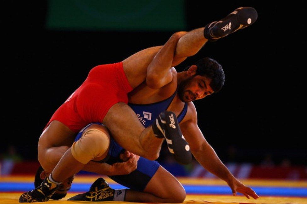 Sushil Kumar of India (blue) on his way to beating Qamar Abbas of Pakistan in the 74kg Freestyle Wrestling Gold medal match at Scottish Exhibition And Conference Centre during day six of the Glasgow 2014 Commonwealth Games on July 29, 2014 in Glasgow, United Kingdom.