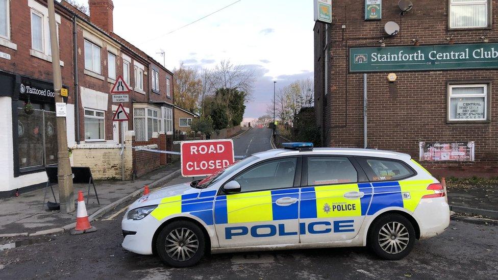 Police car in front of a closed road