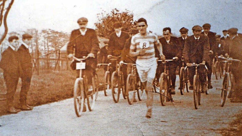 Jack Price running with cyclists