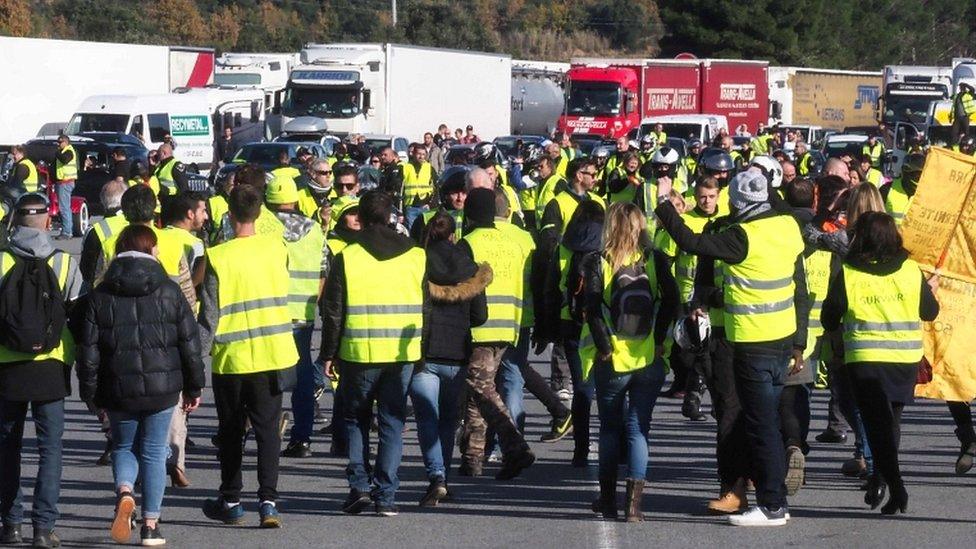 Protesters demonstrate at the A9 highway toll of Le Boulou, southern France on 22 December 2018