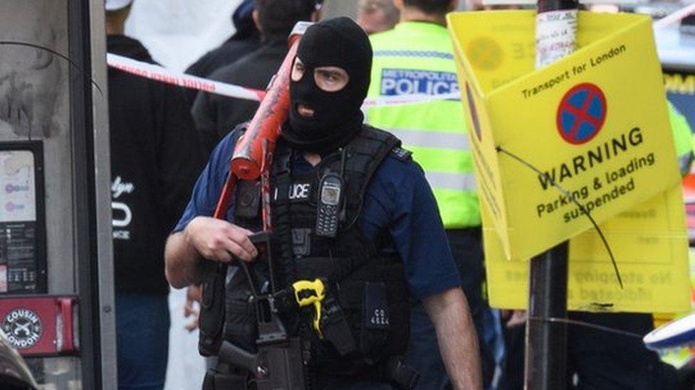 Armed police return to their vehicles following an attack near London Bridge station, 4 June 2017