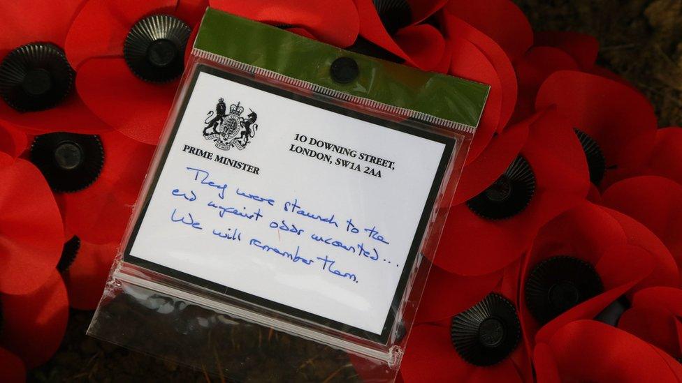 A card left by Mrs May at the grave of George Ellison, the last British soldier to be killed in the war