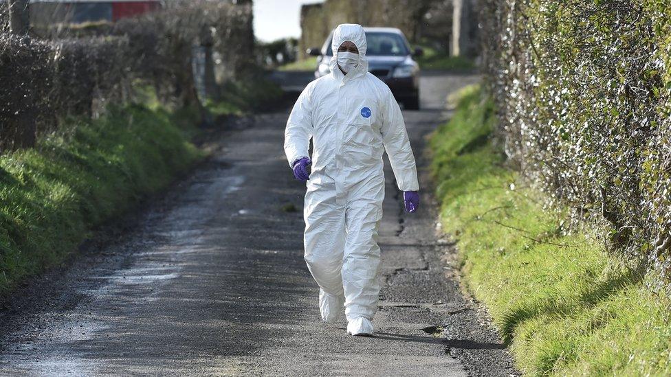 A forensic officer at the scene