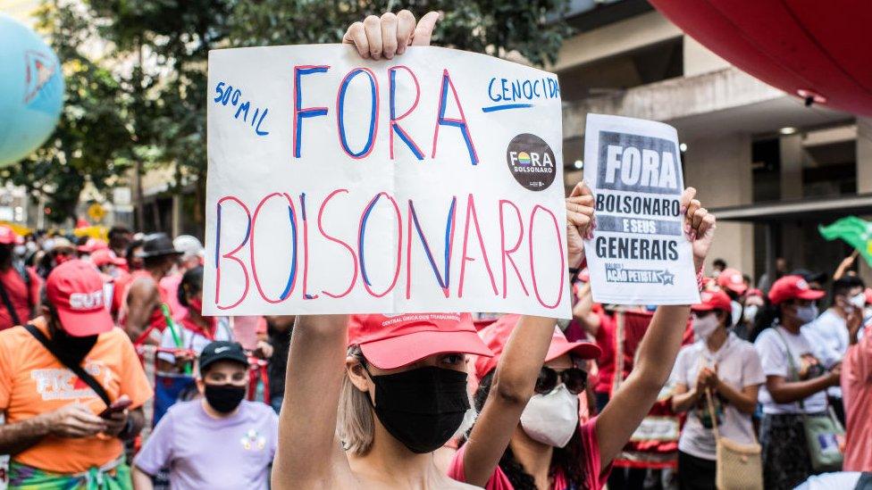 A woman holds a poster with slogan "Bolsonaro Out" during the demonstration. Supporters of Jair Bolsonaro gathered at Praça da Liberdade in Belo Horizonte, Minas Gerais State capital in Brazil on Independence Day. Brazilians took to the streets as they commemorate their Independence Day to show both support and rejection for Jair Bolsonaro's administration.