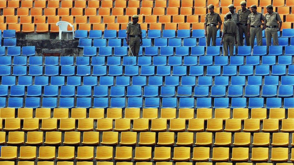 Indian policemen stand guard at the Lumbini Park in Hyderabad after the blasts