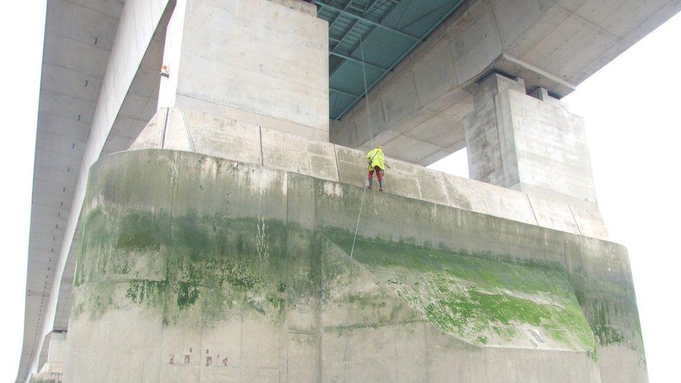 A worker inspects the tower on the M48 Severn Bridge