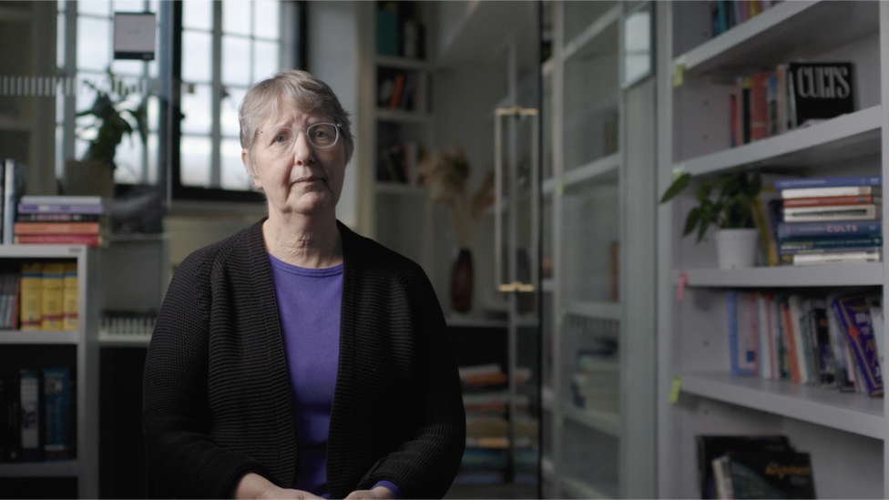 Dr Alexandra Stein, pictured in a book-lined office