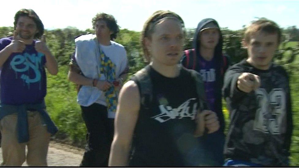 Revellers leaving illegal rave outside Frome, Somerset