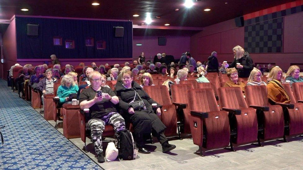 People in a cinema screen