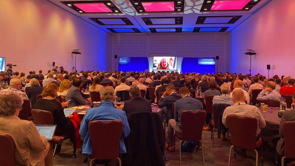 Delegates in a conference hall