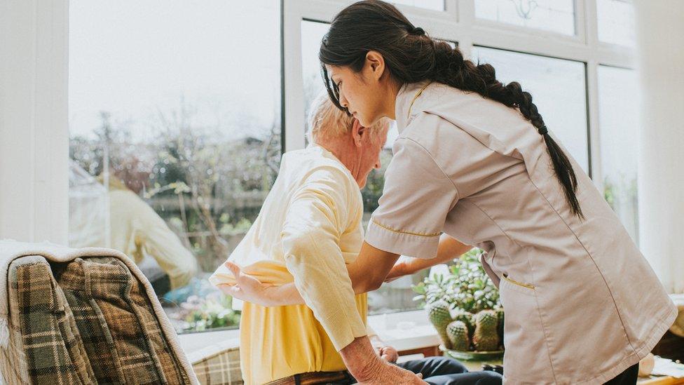 elderly person with carer