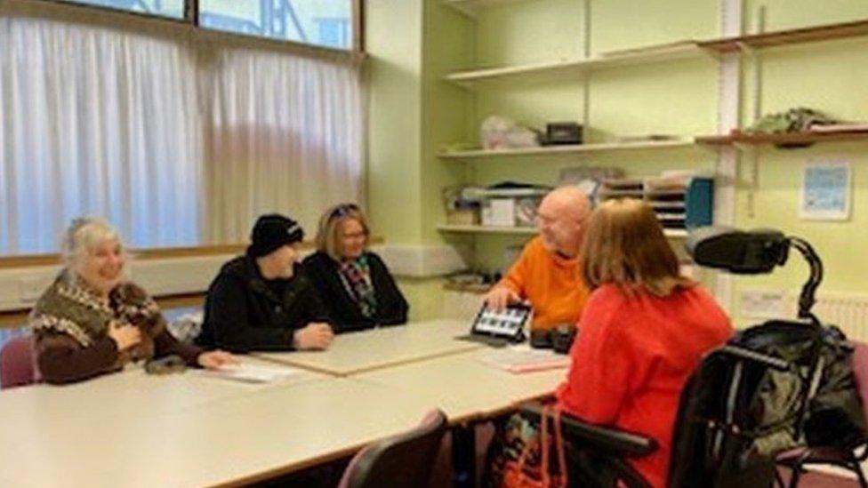 A group of people sat at a table