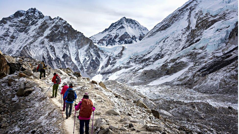 Mountaineers walking in a line.