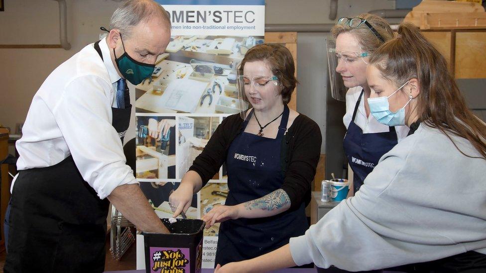 Taoiseach Micheál Martin participating in "hand casting" as he visits Women'sTec while on a day-long visit to Belfast on 8 October 2021