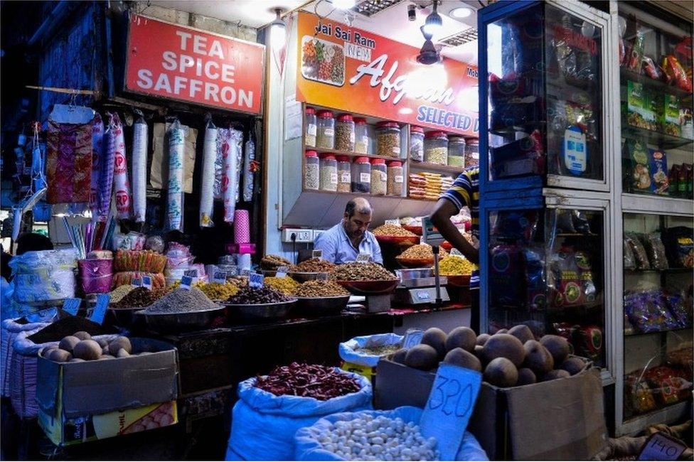 In this photograph taken on August 2, 2016, an Indian vendor works in his shop in the old quarters of New Delhi. India"s politicians are set to debate the Goods and Services Tax(GST) in the Rajya Sabha (Upper House) of the country"s parliament on August 3, potentially the biggest reform in India"s indirect tax structure in the last quarter century.