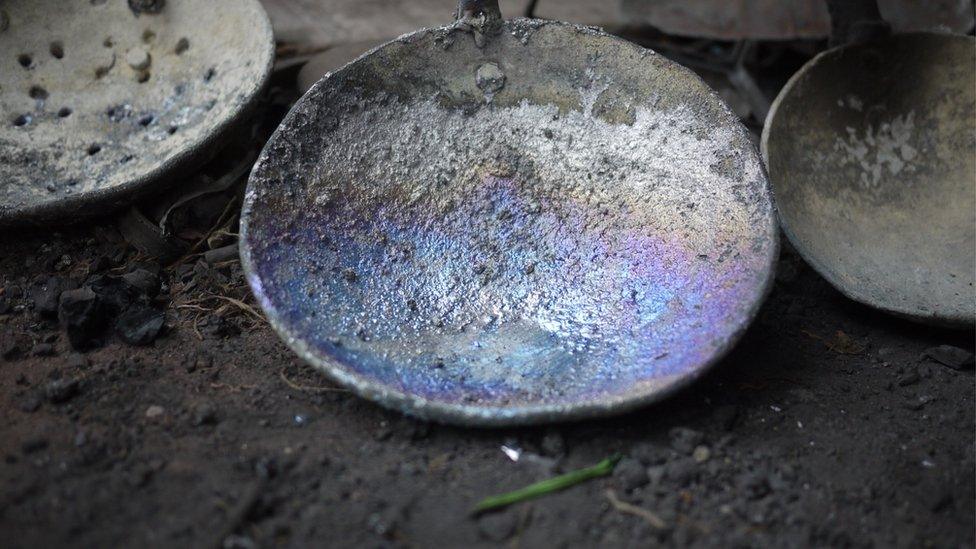 A metal plate eaten up by lead in a factory