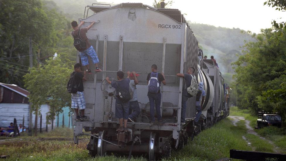 Migrants hitch rides through Mexico on freight trains