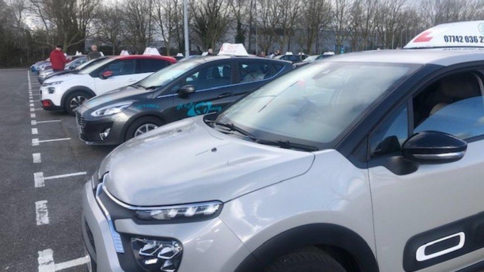 Driving instructors' cars lined up for protest