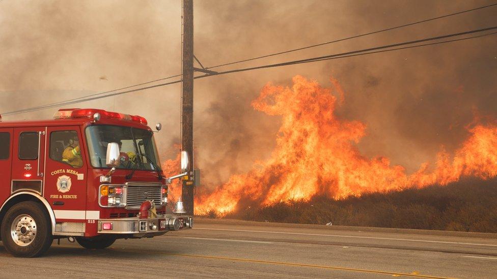 Fire truck next to flames