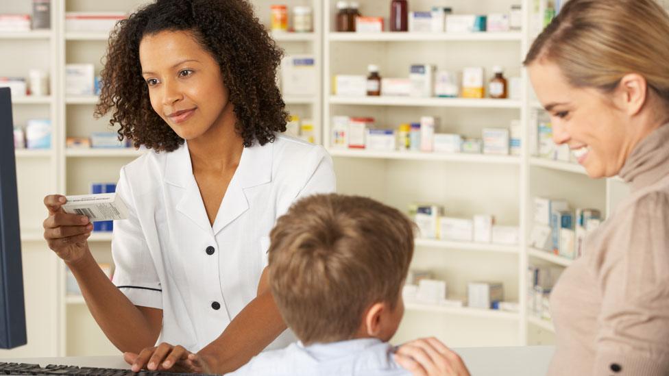 Child with his mother in a pharmacy