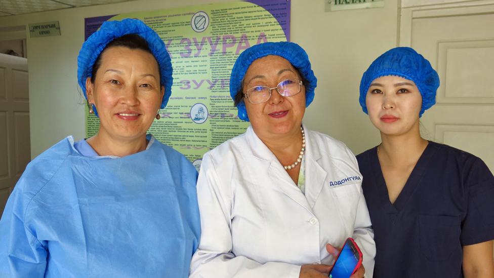 Davaasuren with two nurses at the palliative care unit