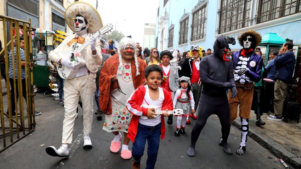 Clowns attend a parade during Peru"s Clown Day celebrations in Lima, Peru May 25, 2018