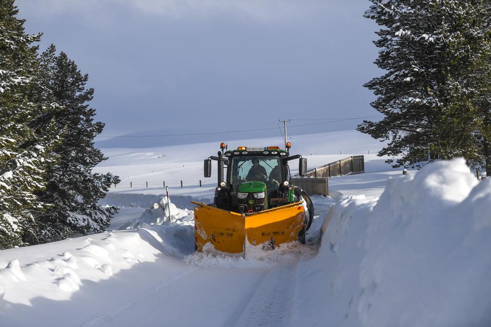 A snow plough is seen clearing snow on 8 February 2021 in Cabrach, Scotland