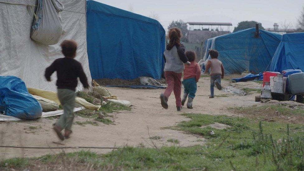 Children play in a makeshift settlement in Turkey