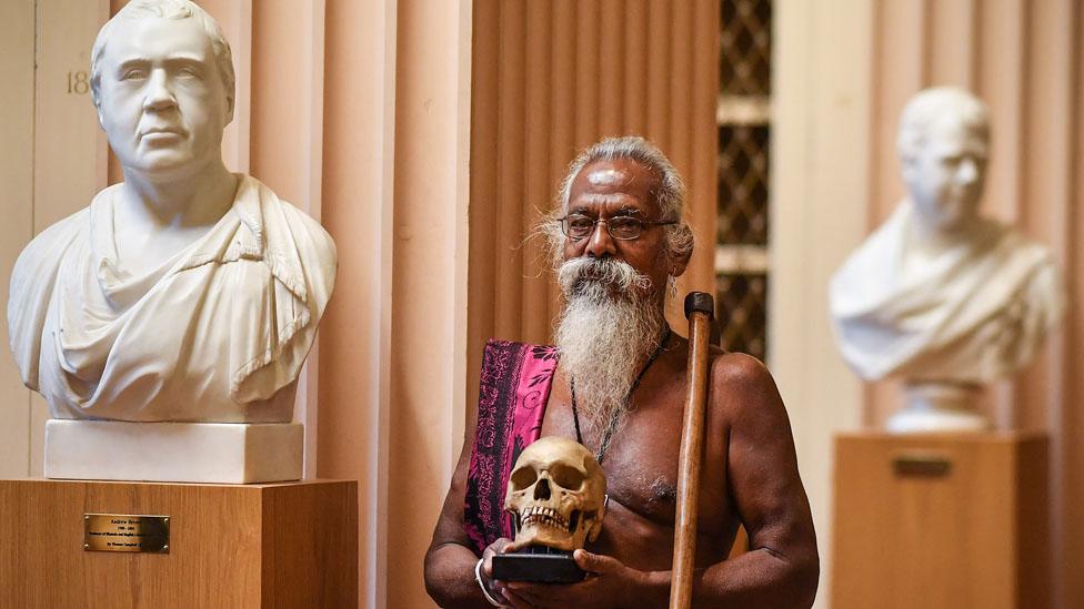 Vedda chief Wanniya Uruwarige with skull