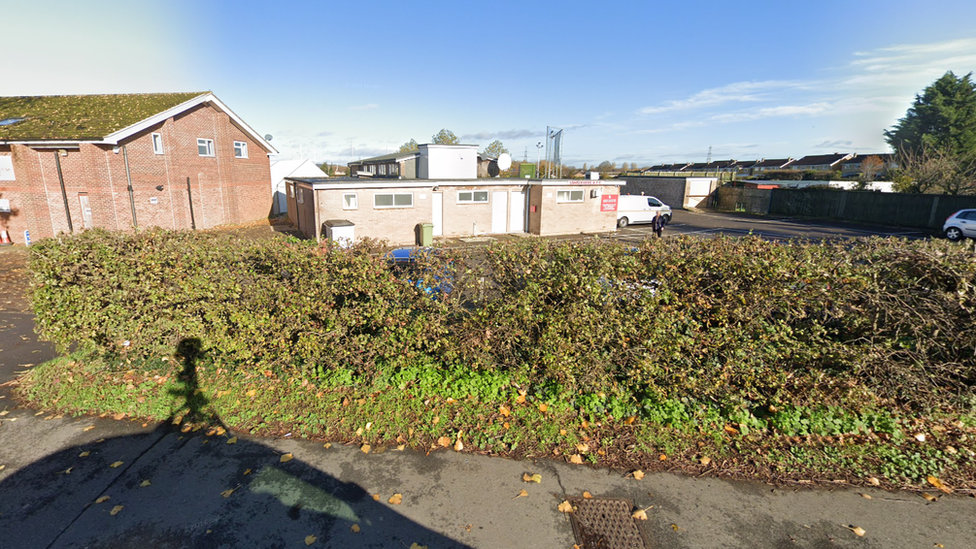 Two buildings housing different sports clubs