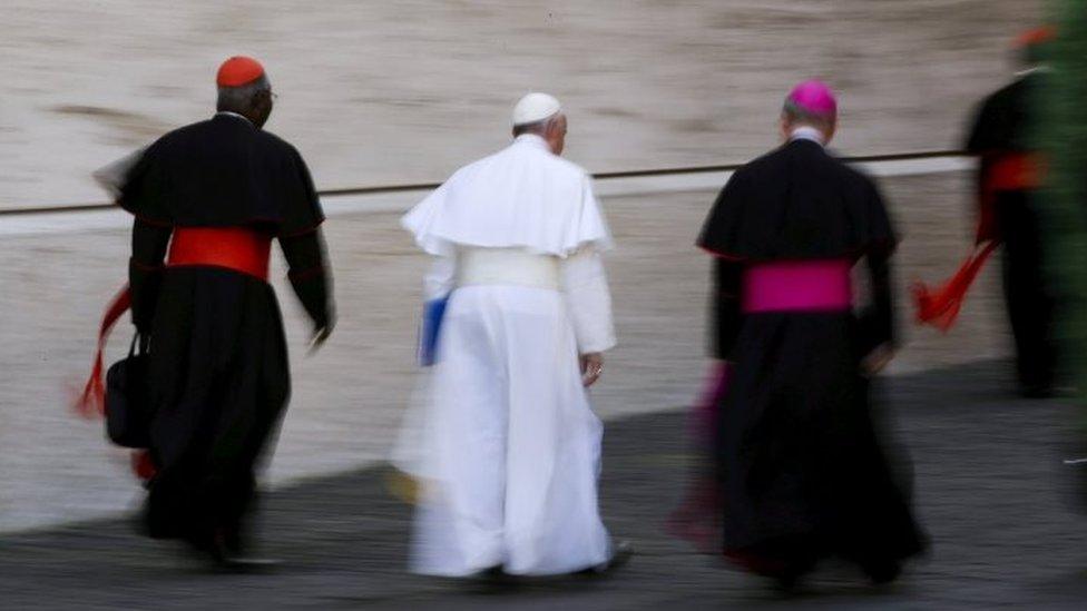 Pope Francis leaves at the end of the morning session of the Synod on the Family at the Synod hall at the Vatican (15 October 2015)