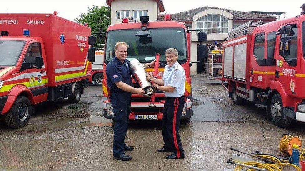 Handing over the fire engines