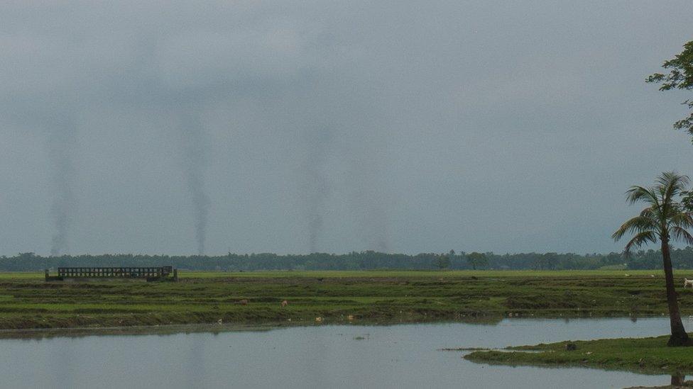 4 columns of smoke on horizon