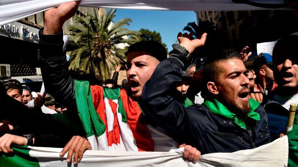 Protesters march through the streets of Algiers