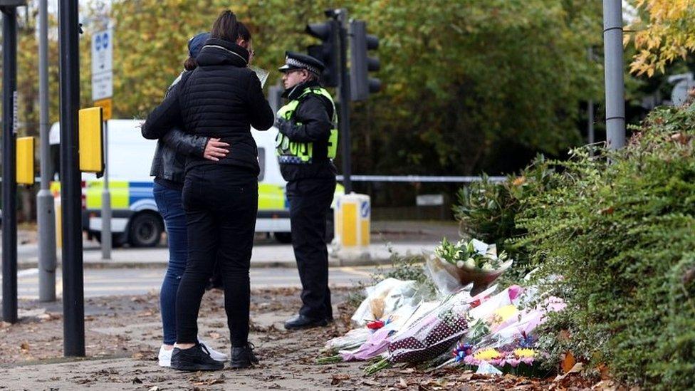 Mourners near tram derailment site