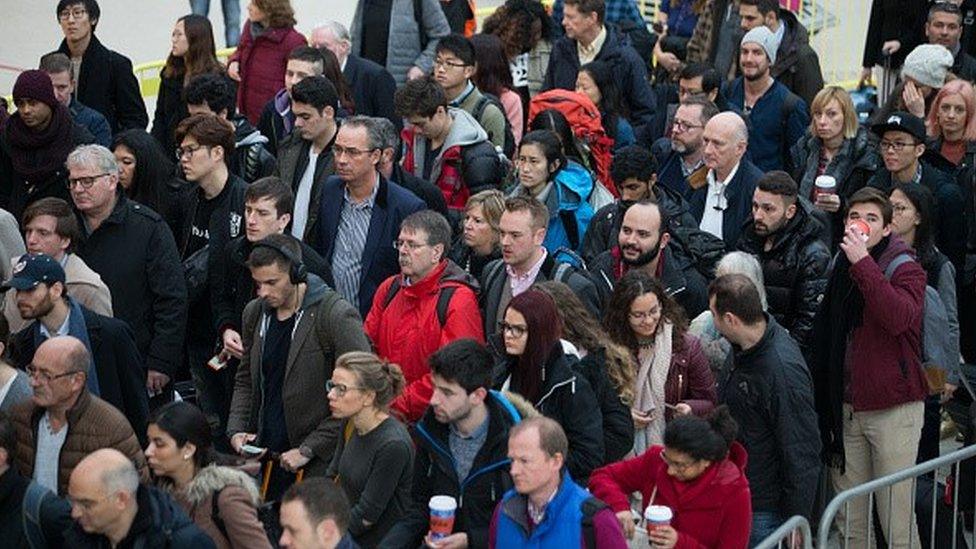 Commuters queuing for train