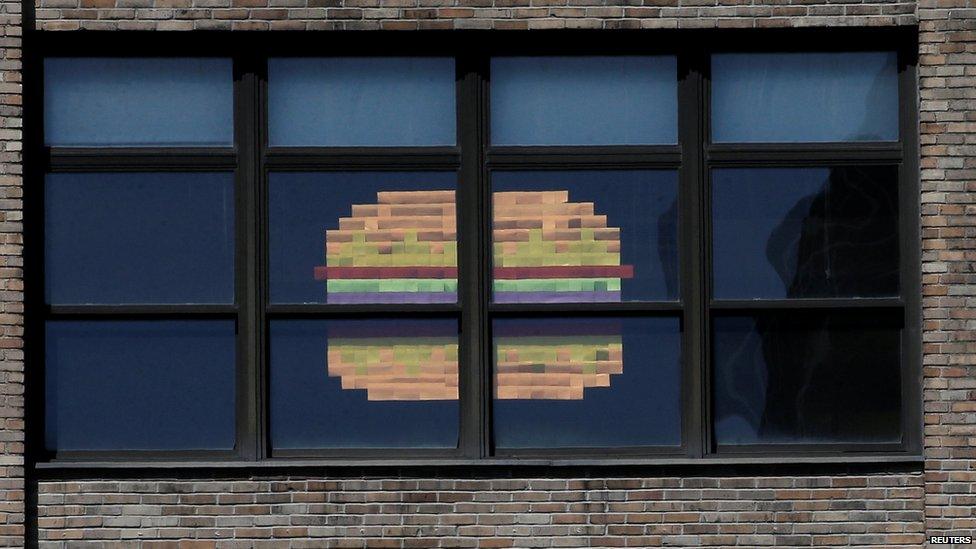 Hamburger made from sticky notes on window