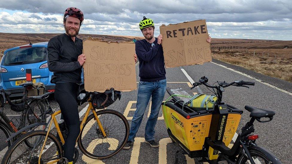 Protest signs on the pass